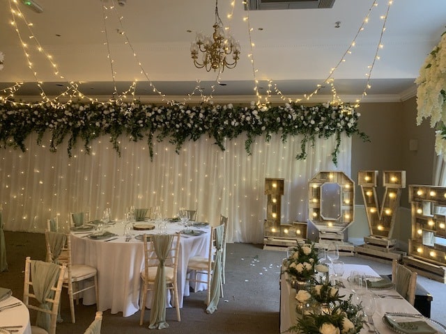 Starlight Backdrop with Silk Green Floral Top Runner