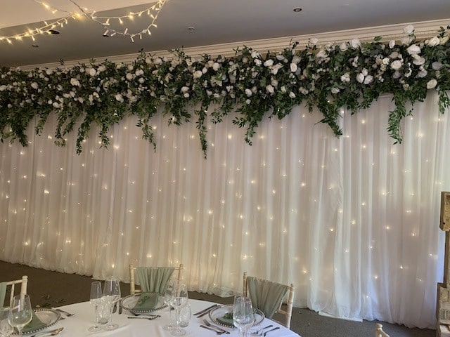 Starlight Backdrop with Silk Green Floral Top Runner